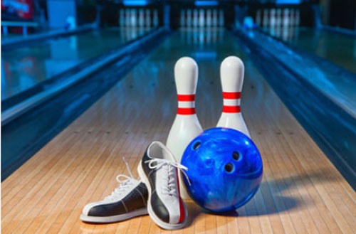 bowling pins and a ball and shoes